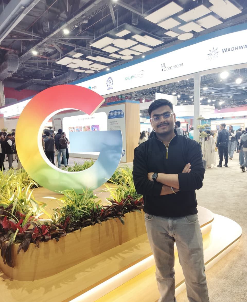 Abhinandan beside the giant Google G at an AI summit in New Delhi